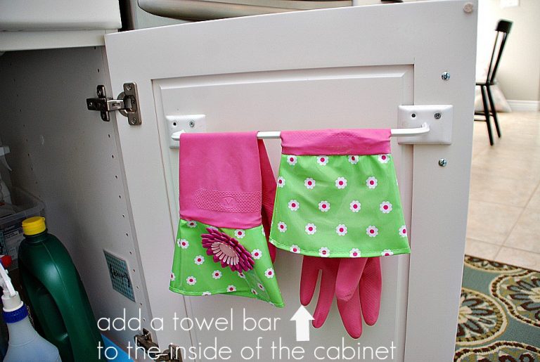 how to store cleaning supplies-install a towel bar on the inside of cabinet door