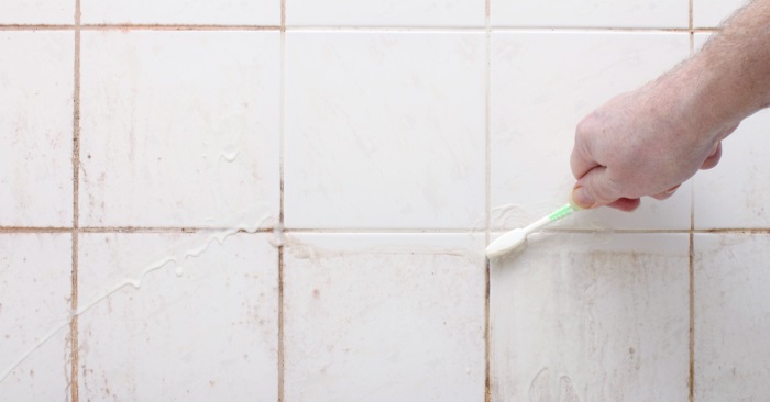 cleaning tile with a toothbrush with spring clean up