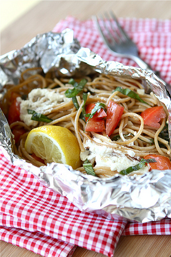 pasta in a foil packet with tomatoes and cheese