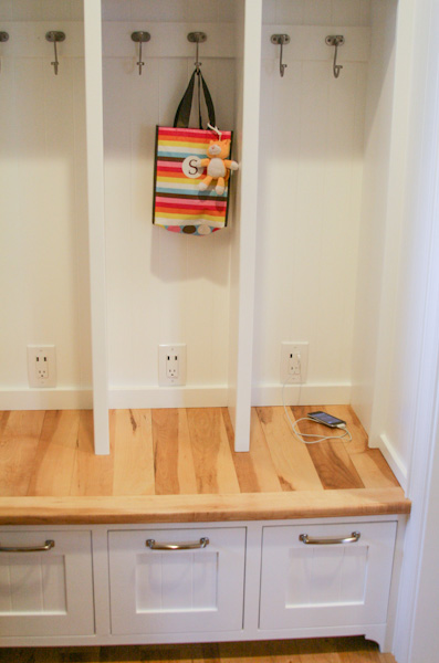 constructed white locker with 3 partitions and cabinets