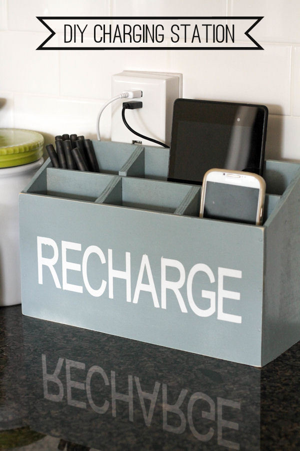 wooden DIY charging station that contains a phone and a tablet