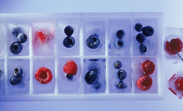 freezing fruit in an ice cube tray