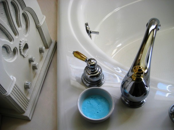 a tub with a small bowl of homemade soft scrub