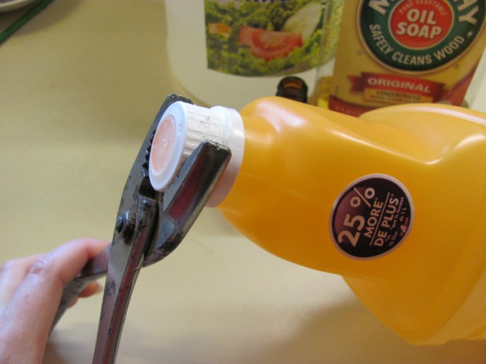 Using pliers to open a Swiffer WetJet bottle