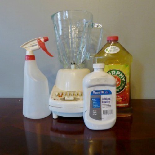 A bottle of Murphy's Oils Soap with a blender, spray bottle and mineral oil