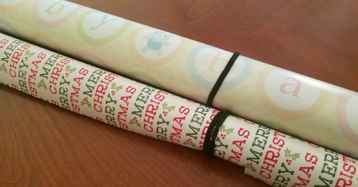 Keep gift wrap organized with rubber bands