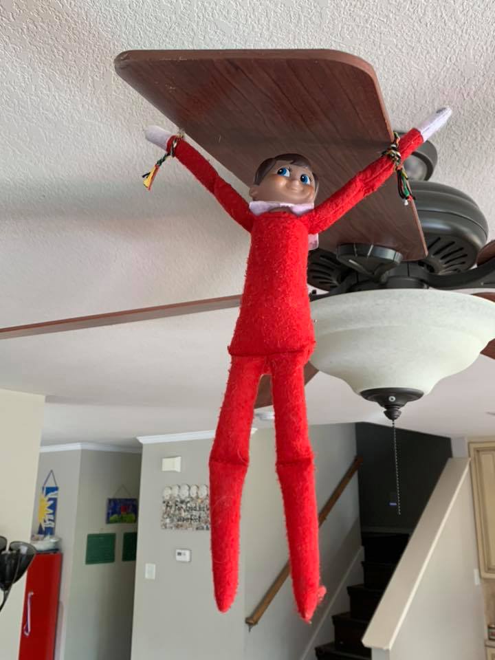 Elf On The Shelf Swinging From Fan