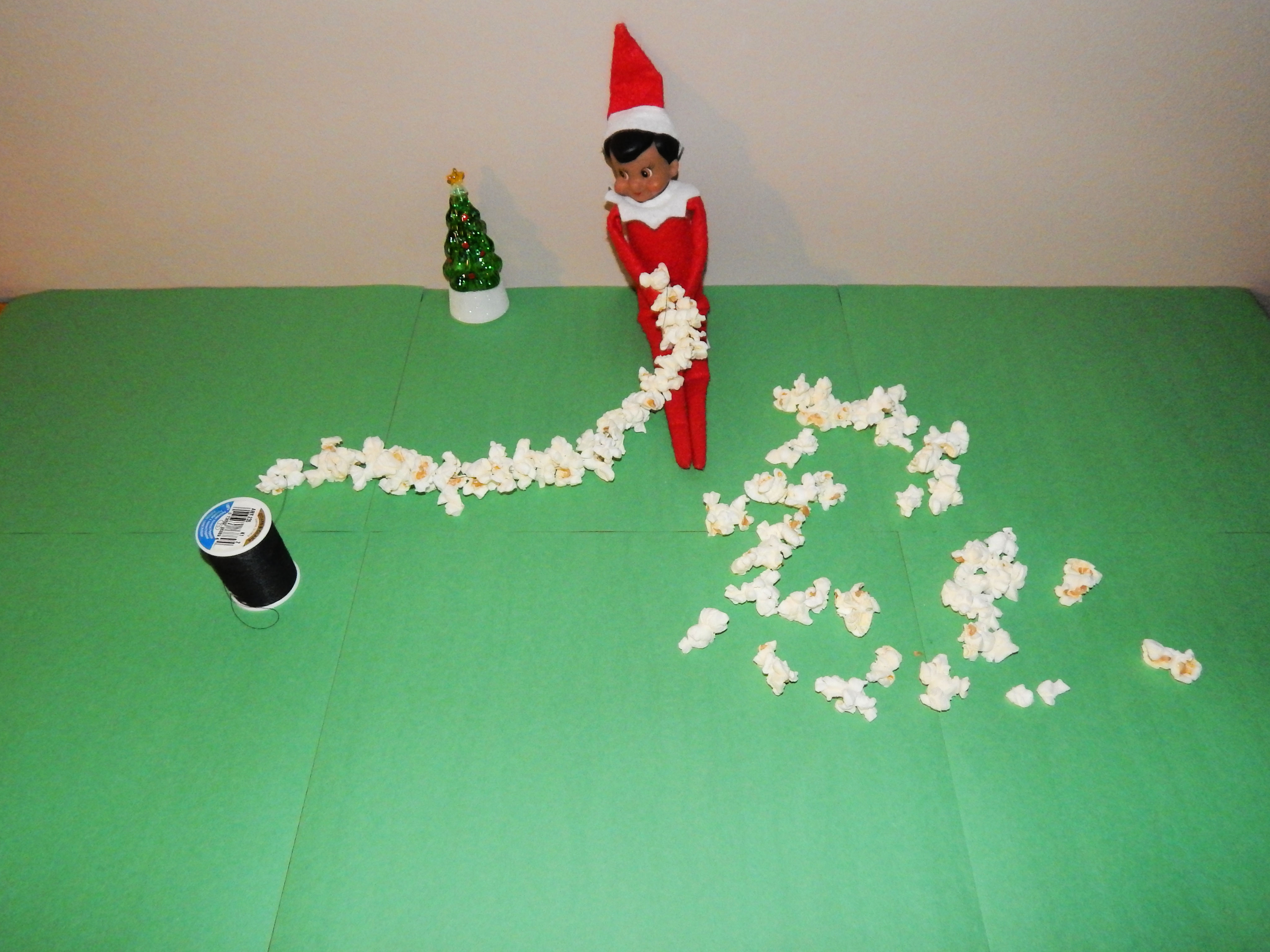 Elf On The Shelf Stringing Popcorn