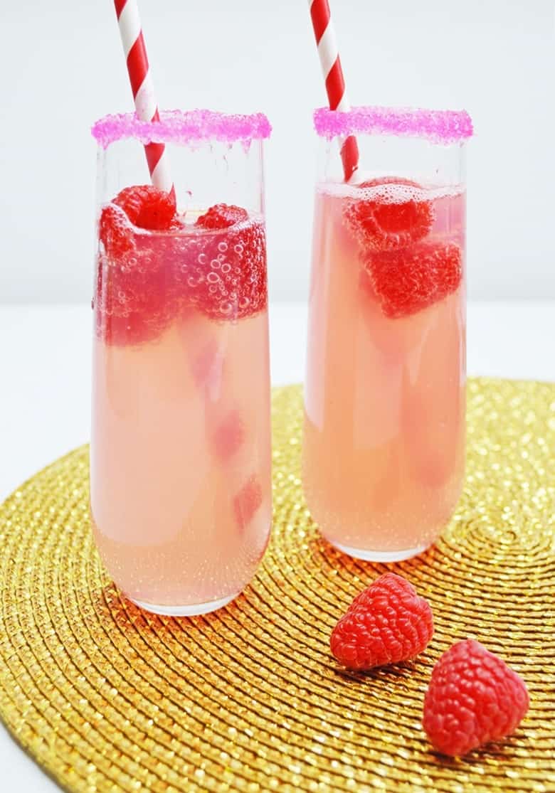 mimosa in glass with raspberries