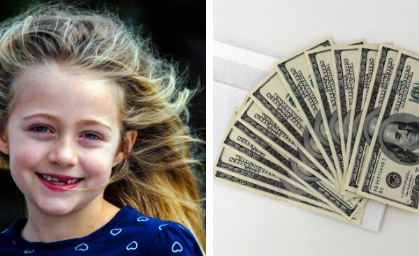 little girl smiling and pile of money