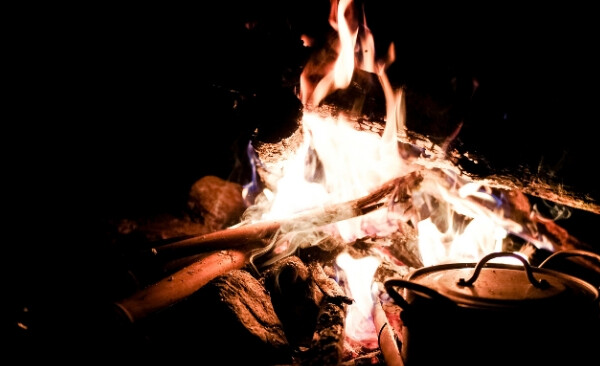 cooking food over the campfire