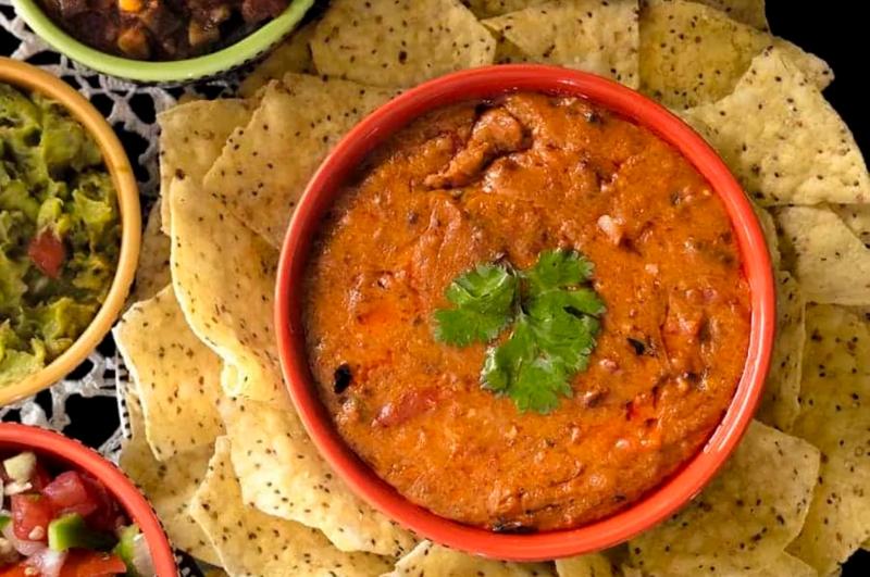 Enjoy Mexican appetizers like this enchilada dip