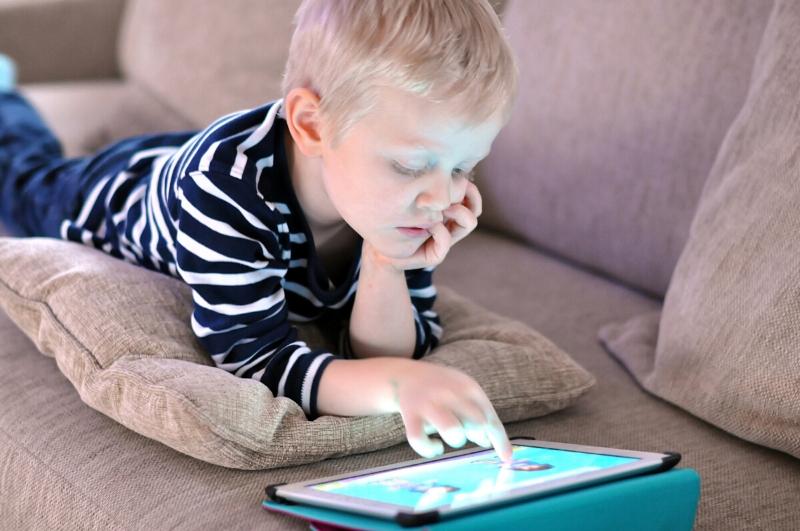 boy playing on a tablet