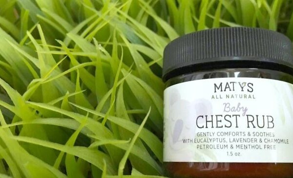 Maty's Baby chest rub tub lying on green grass