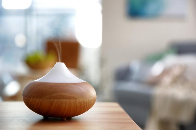 essential oil diffuser releasing mist into the air