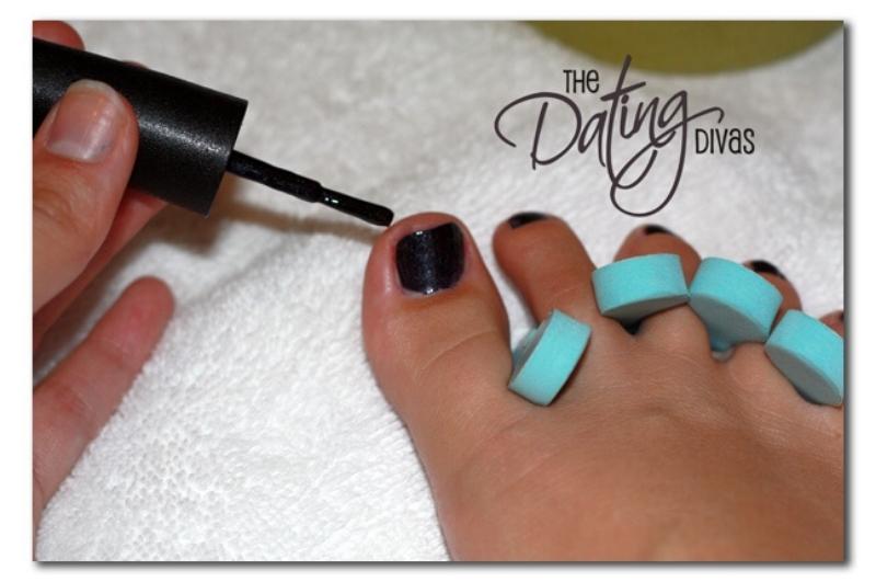 pedicure with black painted toenails