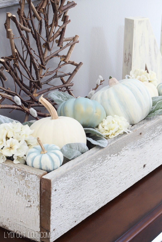 vintage painted faux pumpkins styled together in a wood box