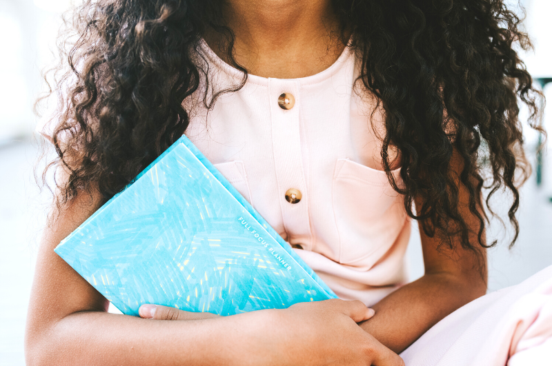 Girl holding a student planner