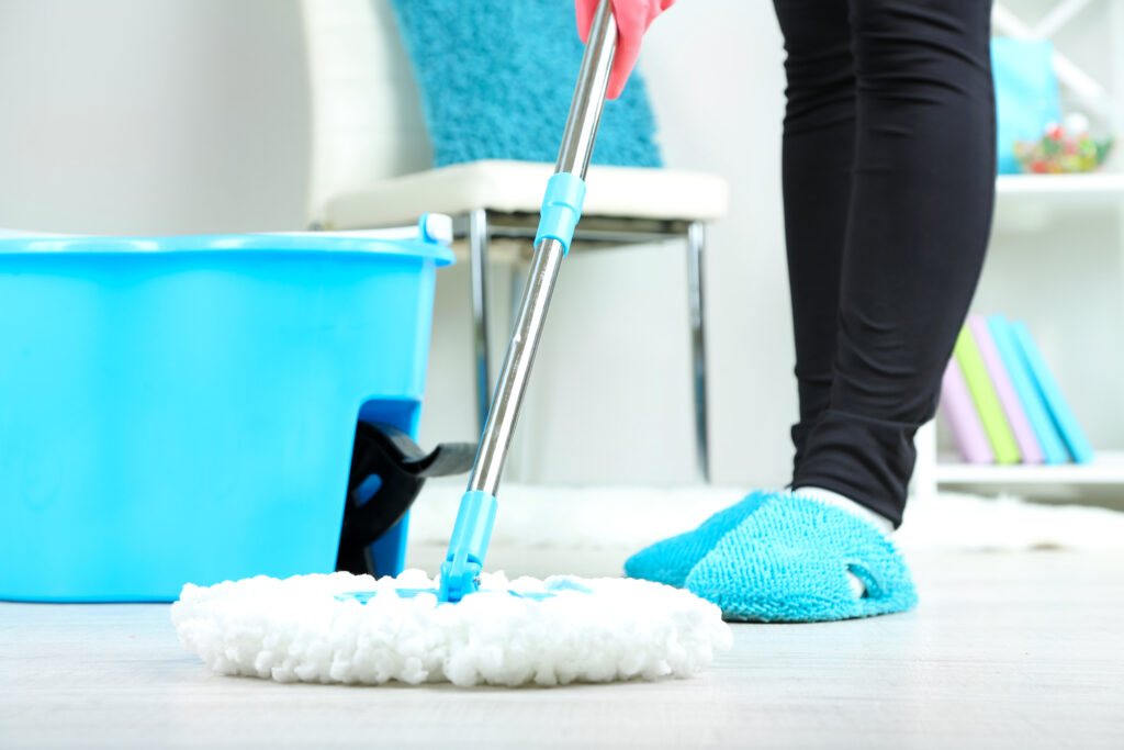 woman mopping the floor closeup