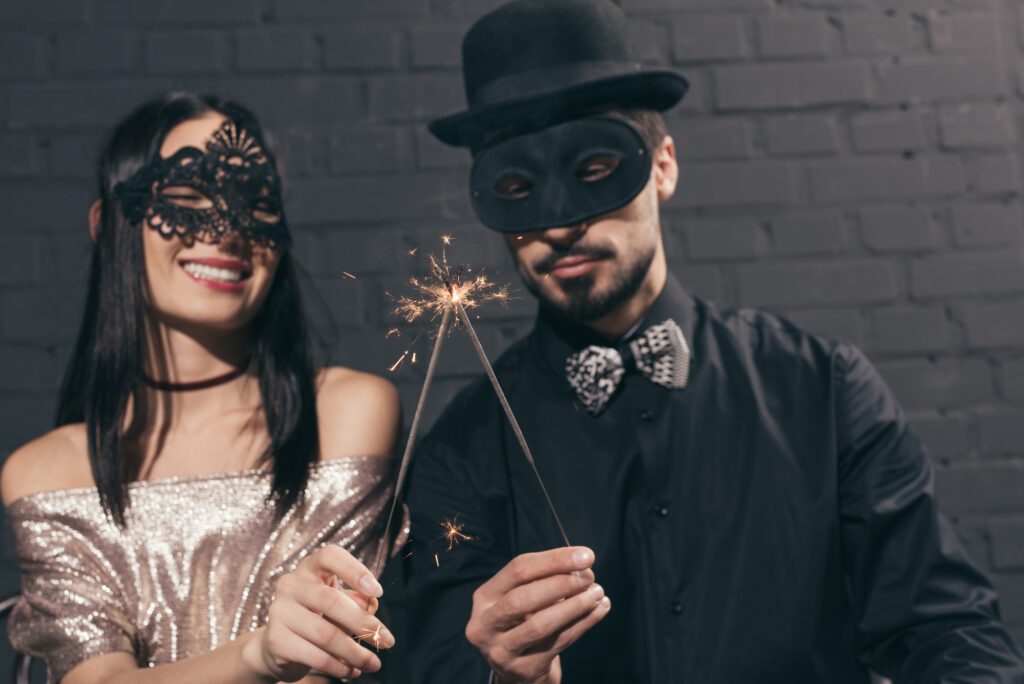 couple dressed for masquerade new year's party theme