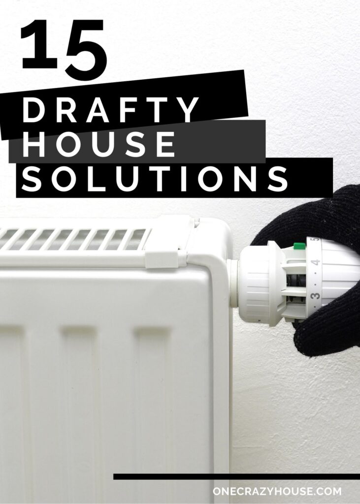 drafty house solutions - gloved hand adjusting thermostat