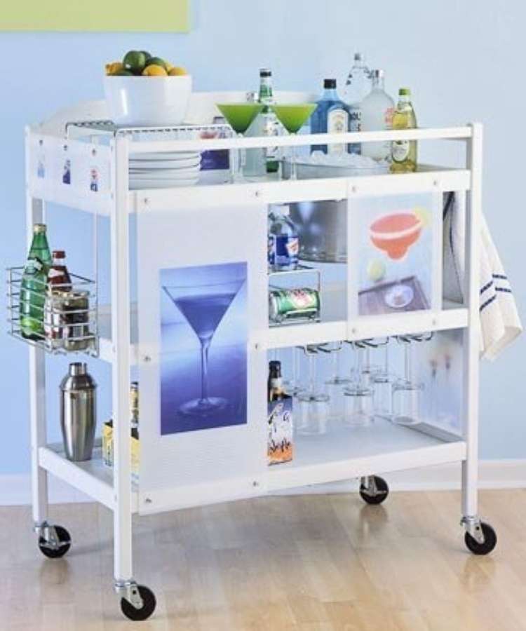 White repurposed changing tables built into a margarita cart with classes and shaker