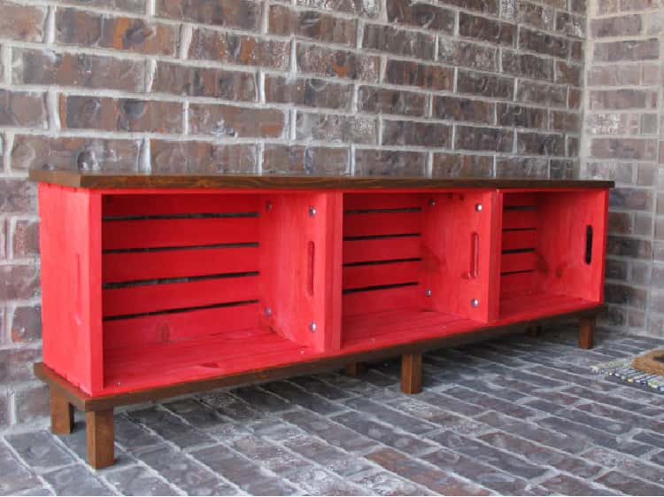 red outdoor storage bench from wooden crates