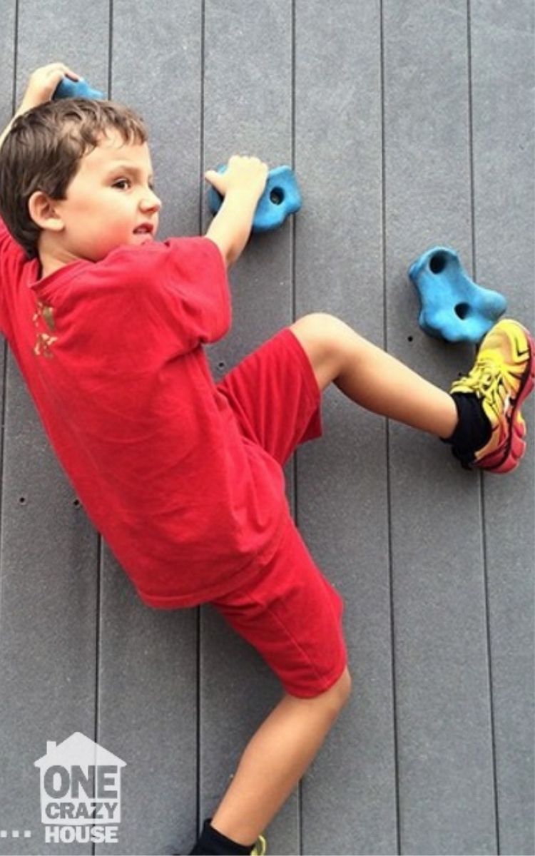 Child climbing on a climbing wall