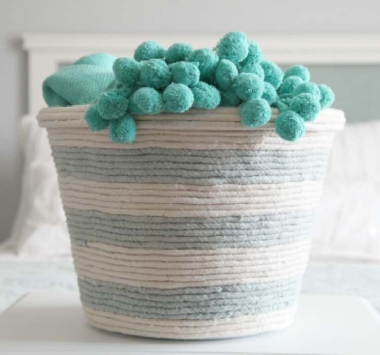 Picture of a laundry basket wrapped in rope to make decorated storage