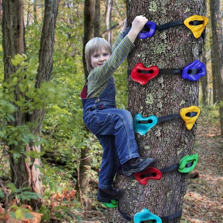 child climbing tree