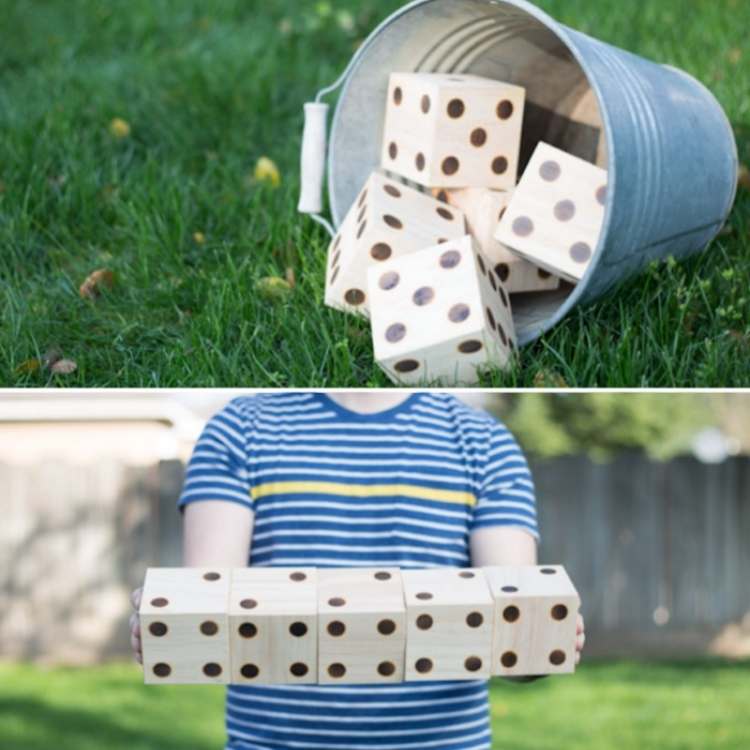 bucket of wooden dice, boy holding wooden dice