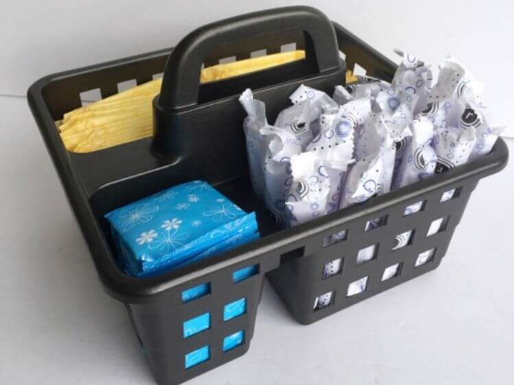 Under bathroom sink storage - shower caddie used to store feminine hygiene products