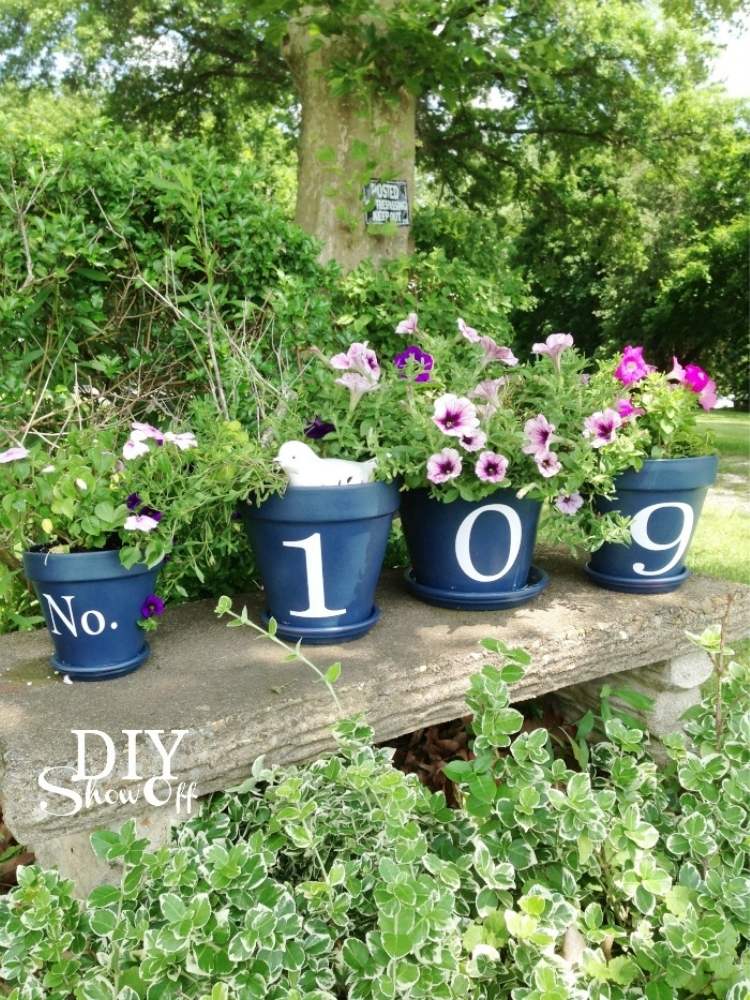 Picture of DIY flower pots with house number painted on them