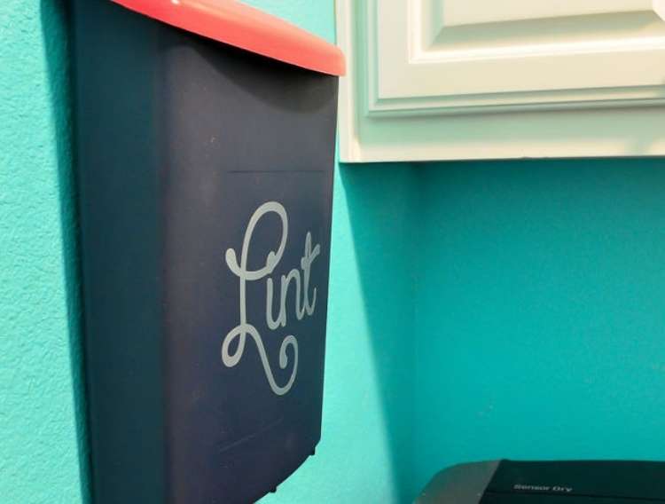 OneCrazyHouse Fastest way to dry clothes Waste basket hanging on wall with the word "lint" written on it