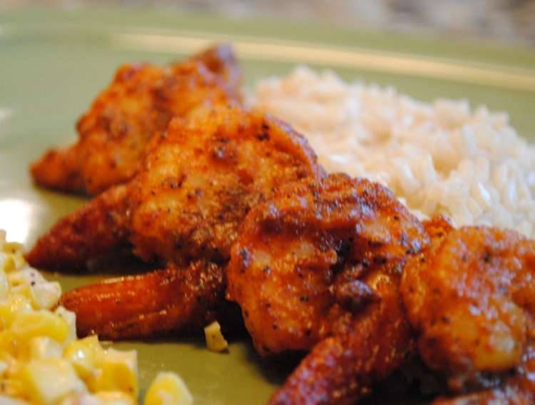 OneCrazyHouse Red Lobster Copycat recipes plate with cajun shirmp piled up in front of a serving of rice