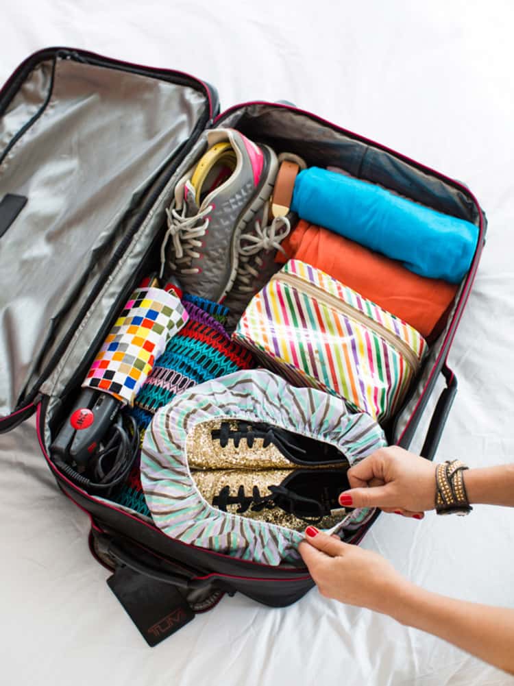 Packing shoes inside a shower cap in your luggage, for easy travel