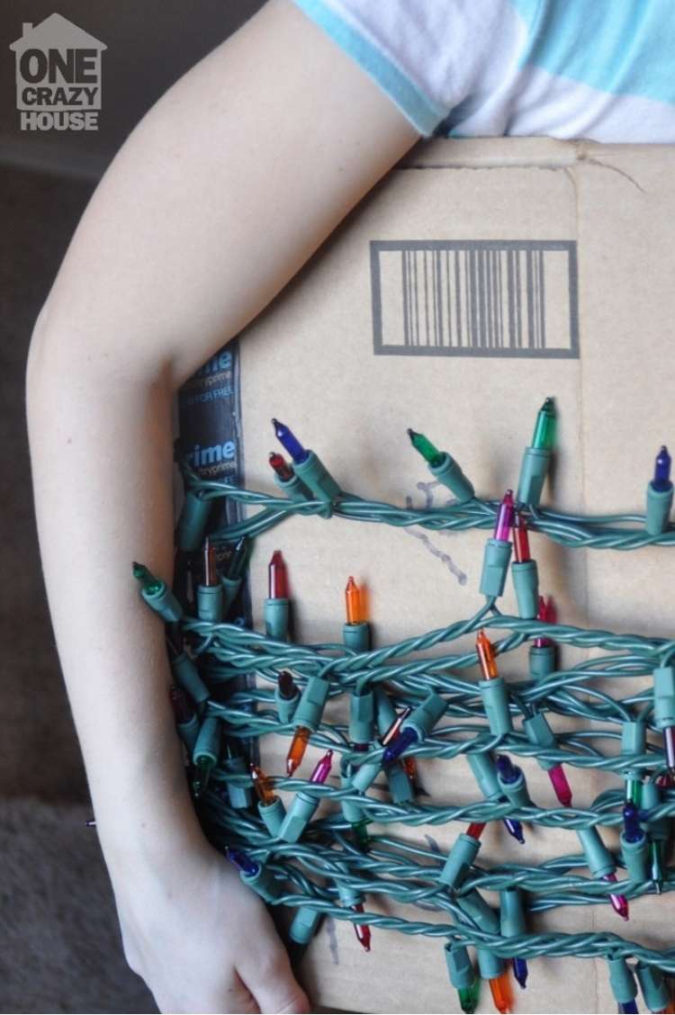 christmas lights wrapped around cardboard to keep them tangle-free