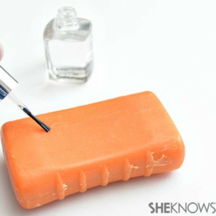 April Fool's Day prank mom painting clear nail polish on a bar of dry soap so it won't lather