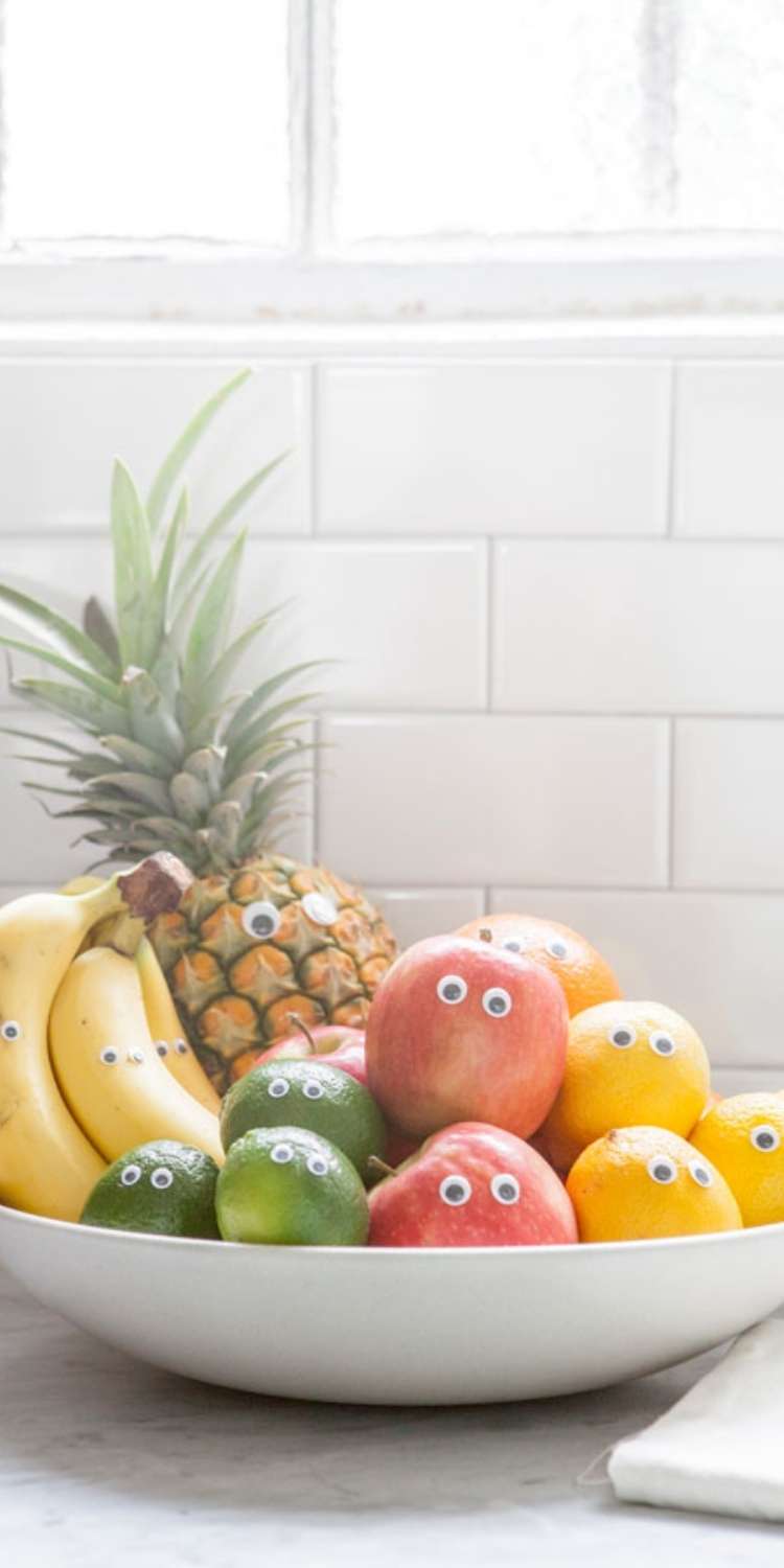 April fools prank, a plate full of fruit with googly eyes to make funny fruit faces