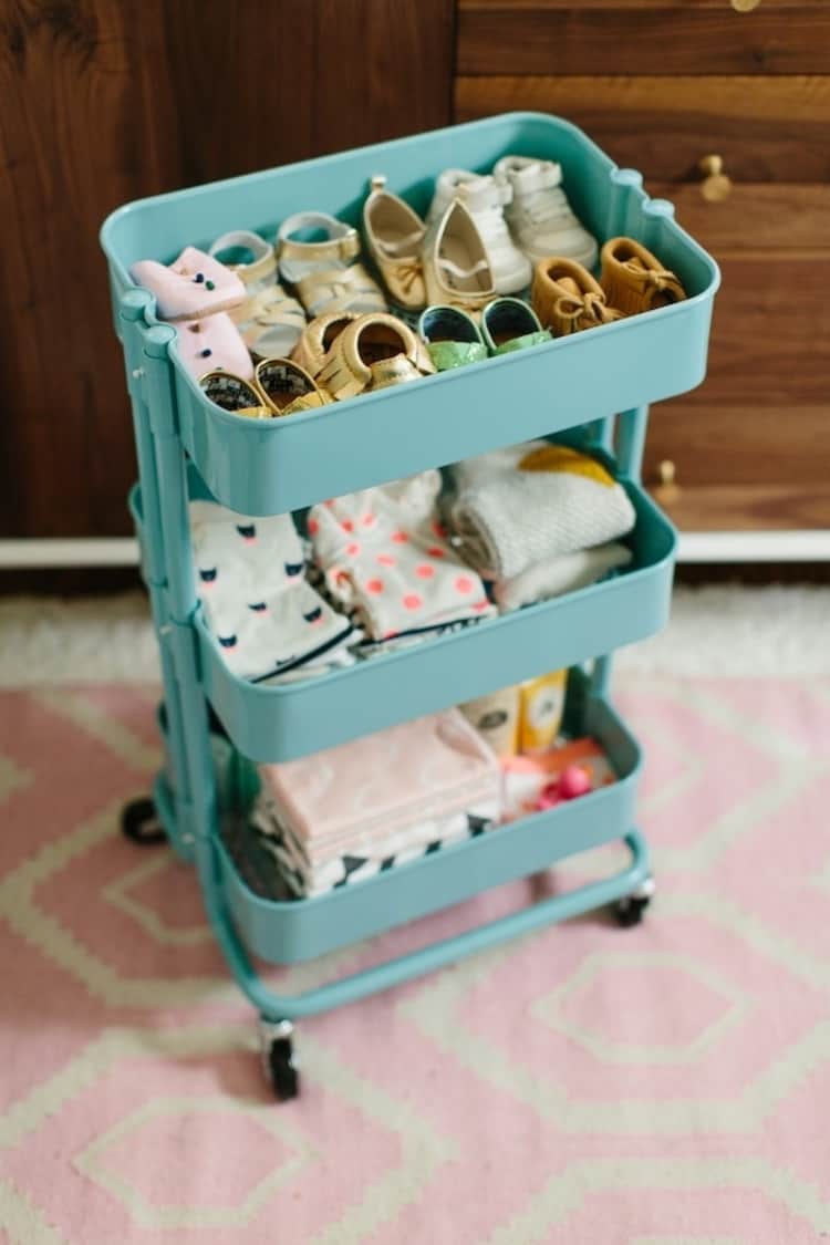 a cart with baby clothes and shoes