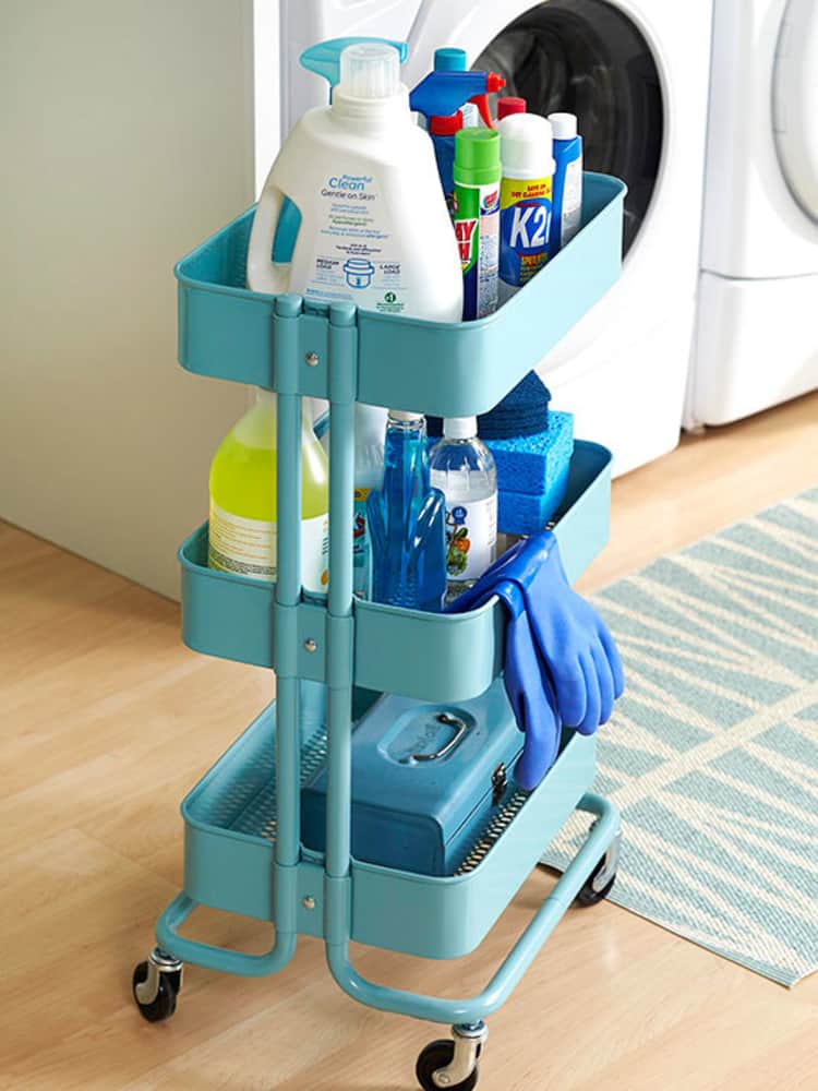 a rolling cart with laundy supplies in a laundry room