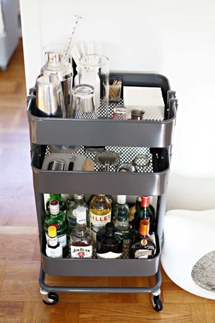cart with bar accessories and liquor