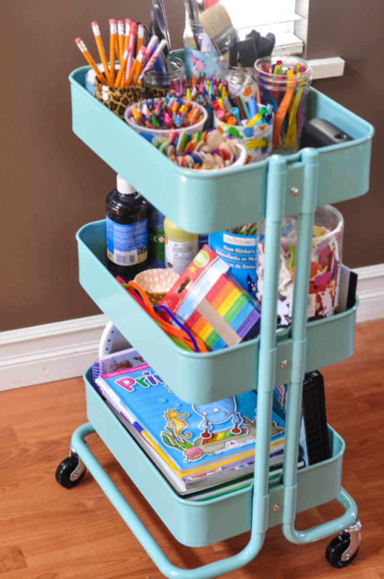 a cart with kids craft and art supplies