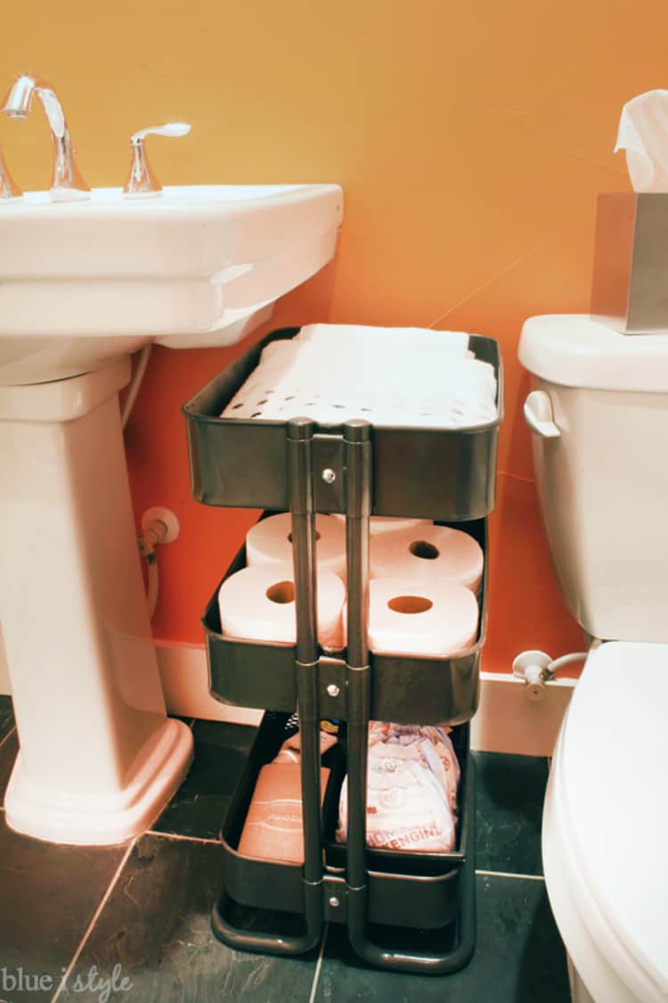 a rolling cart for bathroom storage of toilet paper and handtowels