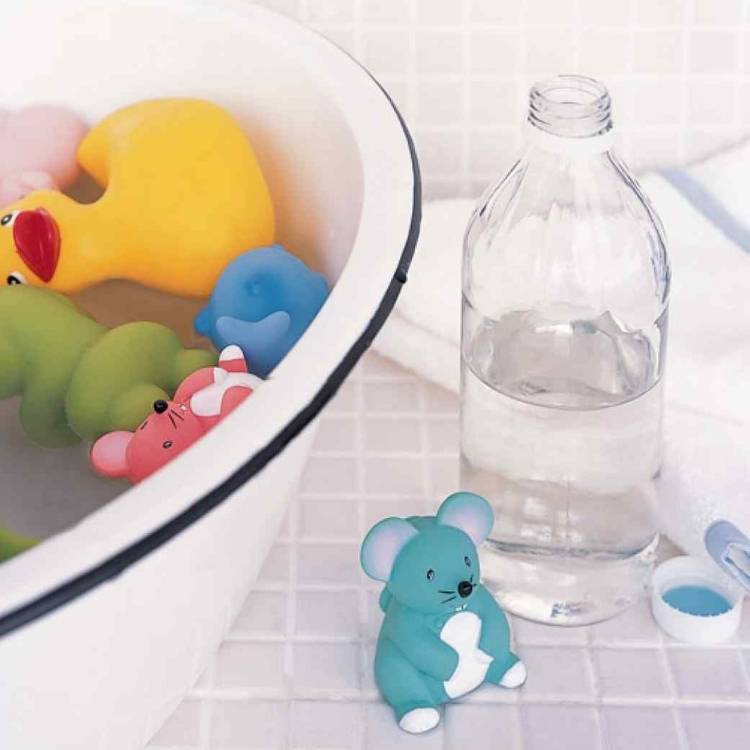 kids' bath toys soaked in warm water with vinegar