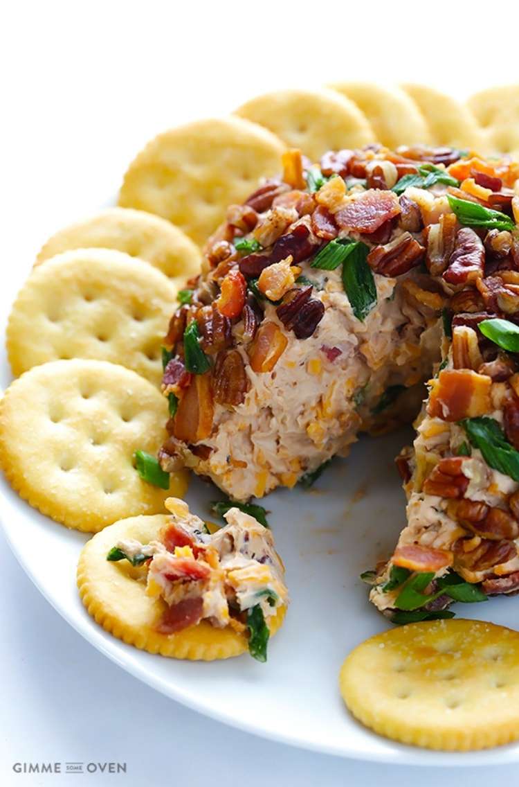 Bbq bacon and cheese ball  on a circle plate with crackers