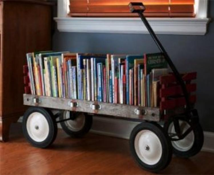 old wagon repurposed into a book holder full of books