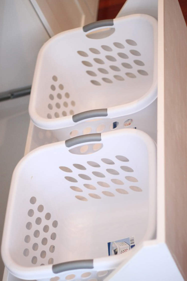 Laundry baskets hidden away out of sight in an adapted drawer.