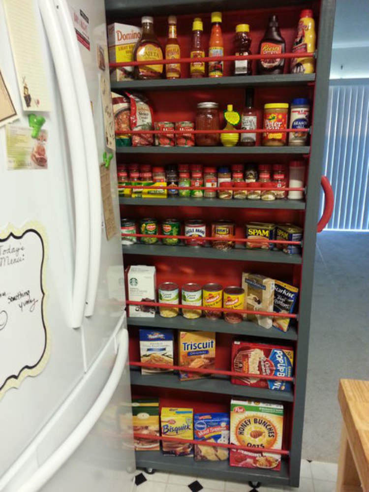 A clever roll-out pantry to utilize the wasted space between the refrigerator and the wall.