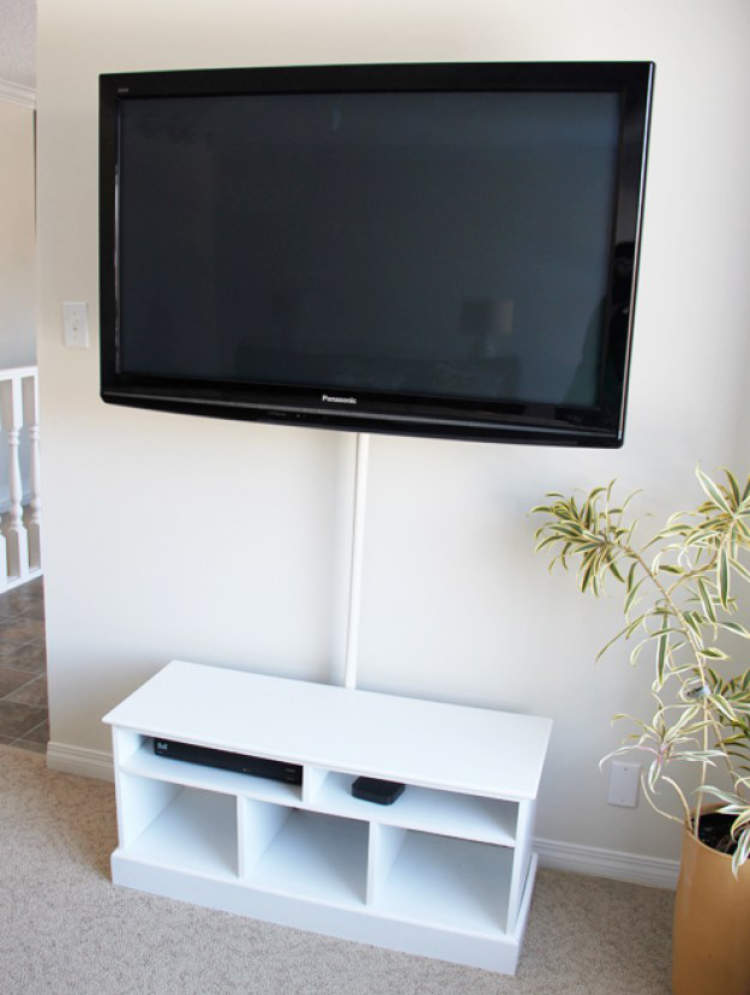 shower rod being used to hide cables from a wall mounted TV